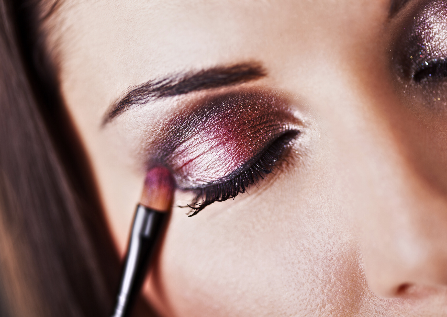 a woman with bright bold purple eyeshadow, illustrating the creative potential of experimenting with eye make-up colours